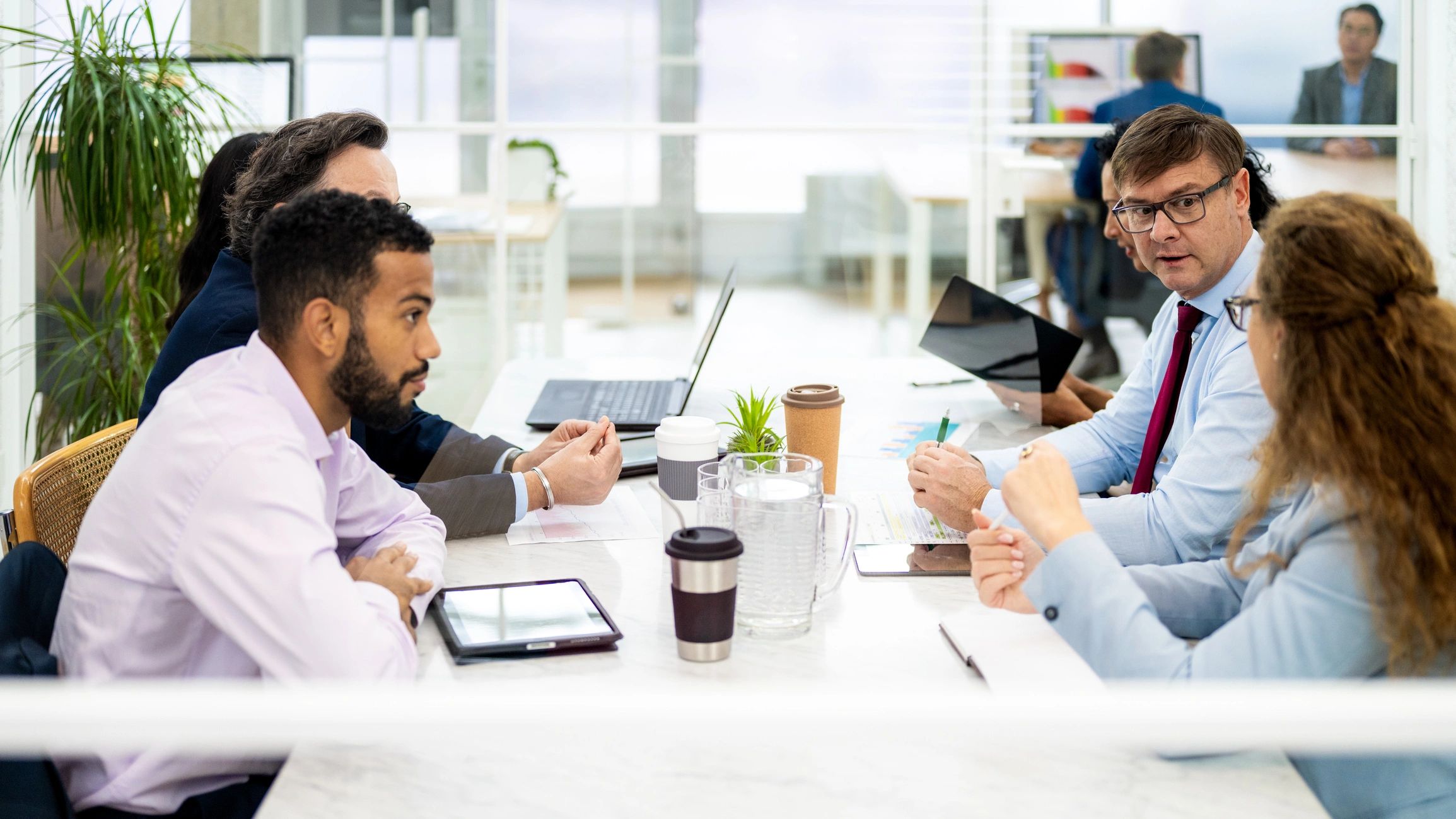 Business team discussing payroll and operations in an office meeting