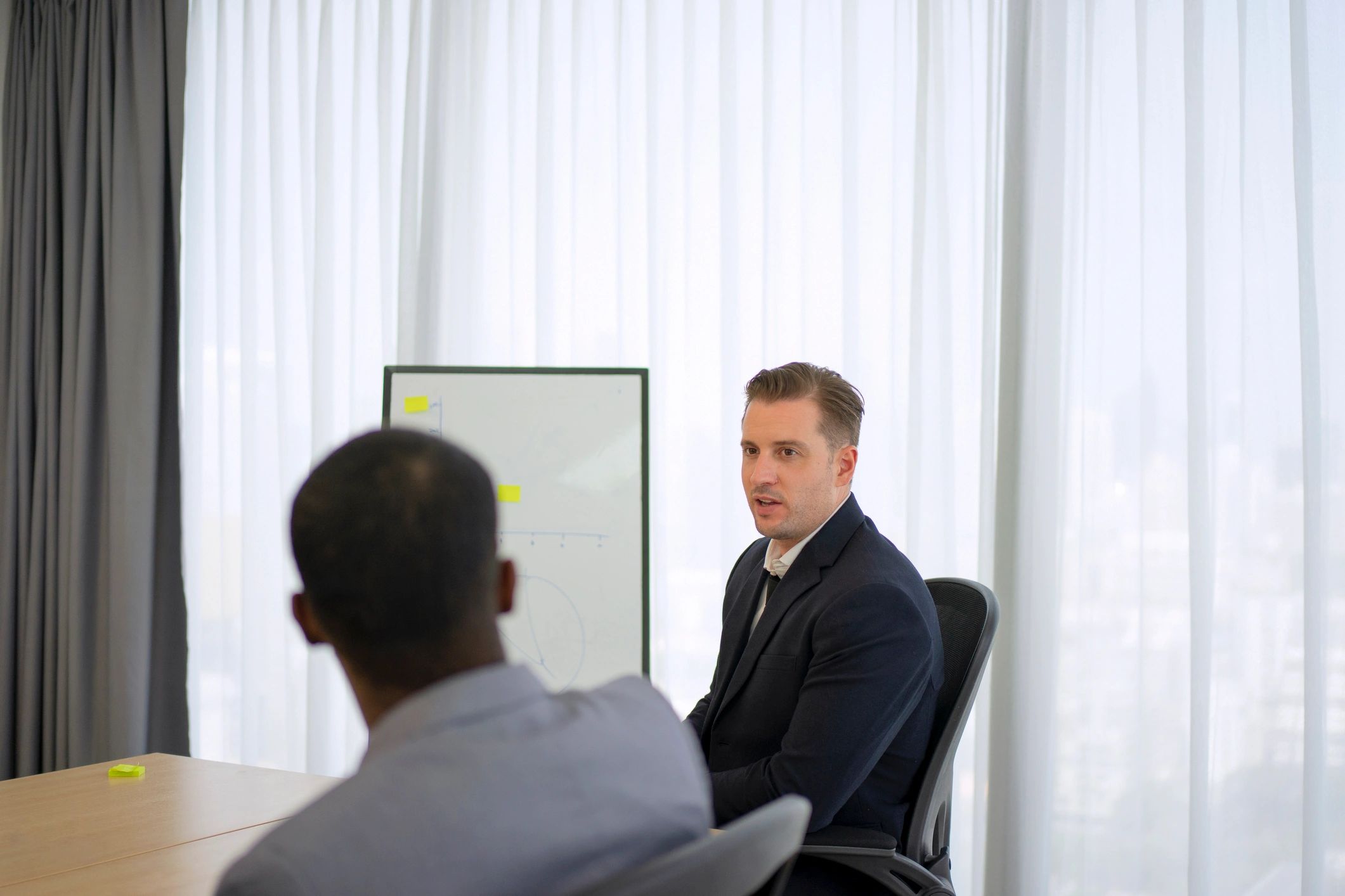 Professionals reviewing financial plans in a meeting room