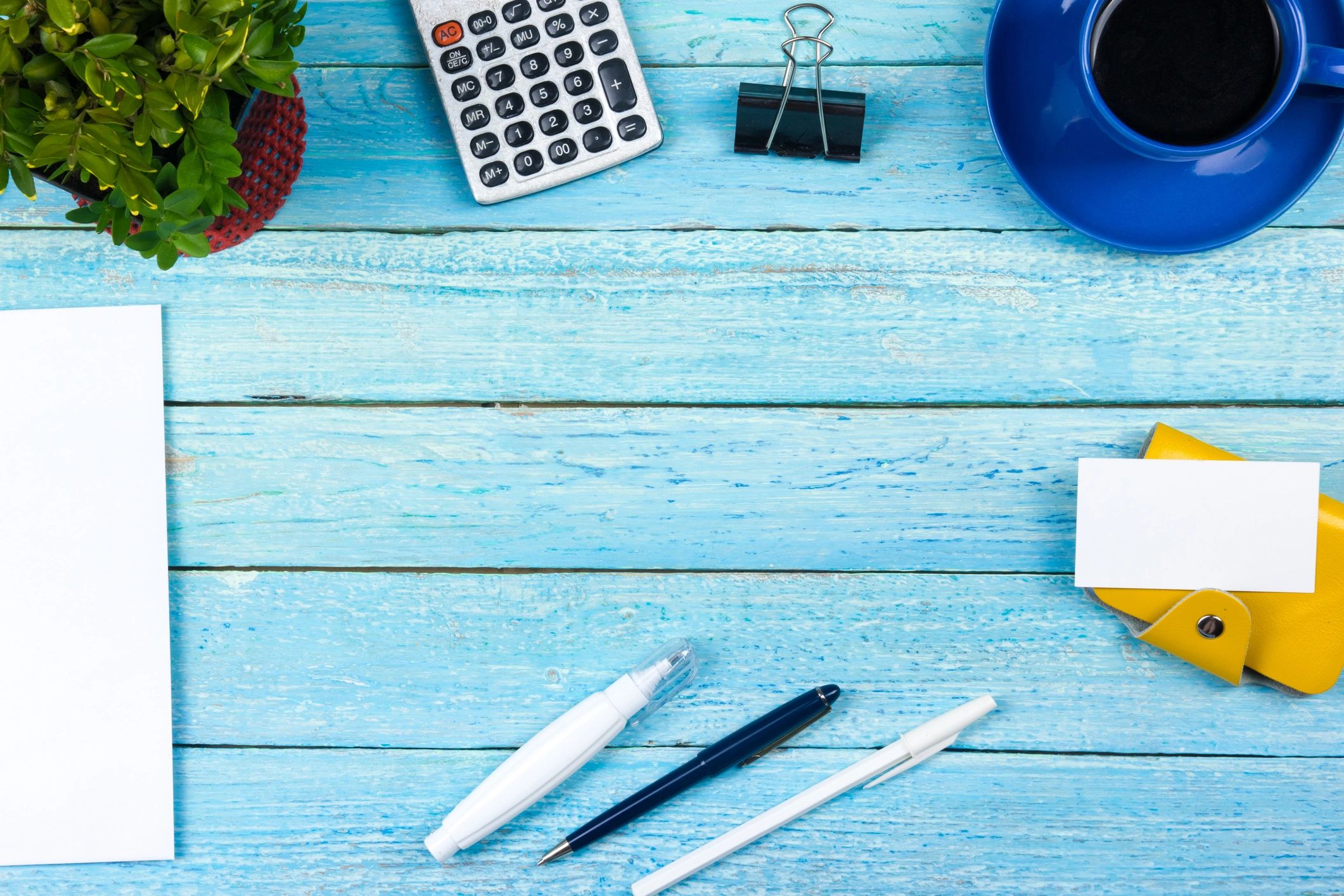 Office desk with computer, coffee, and financial work materials
