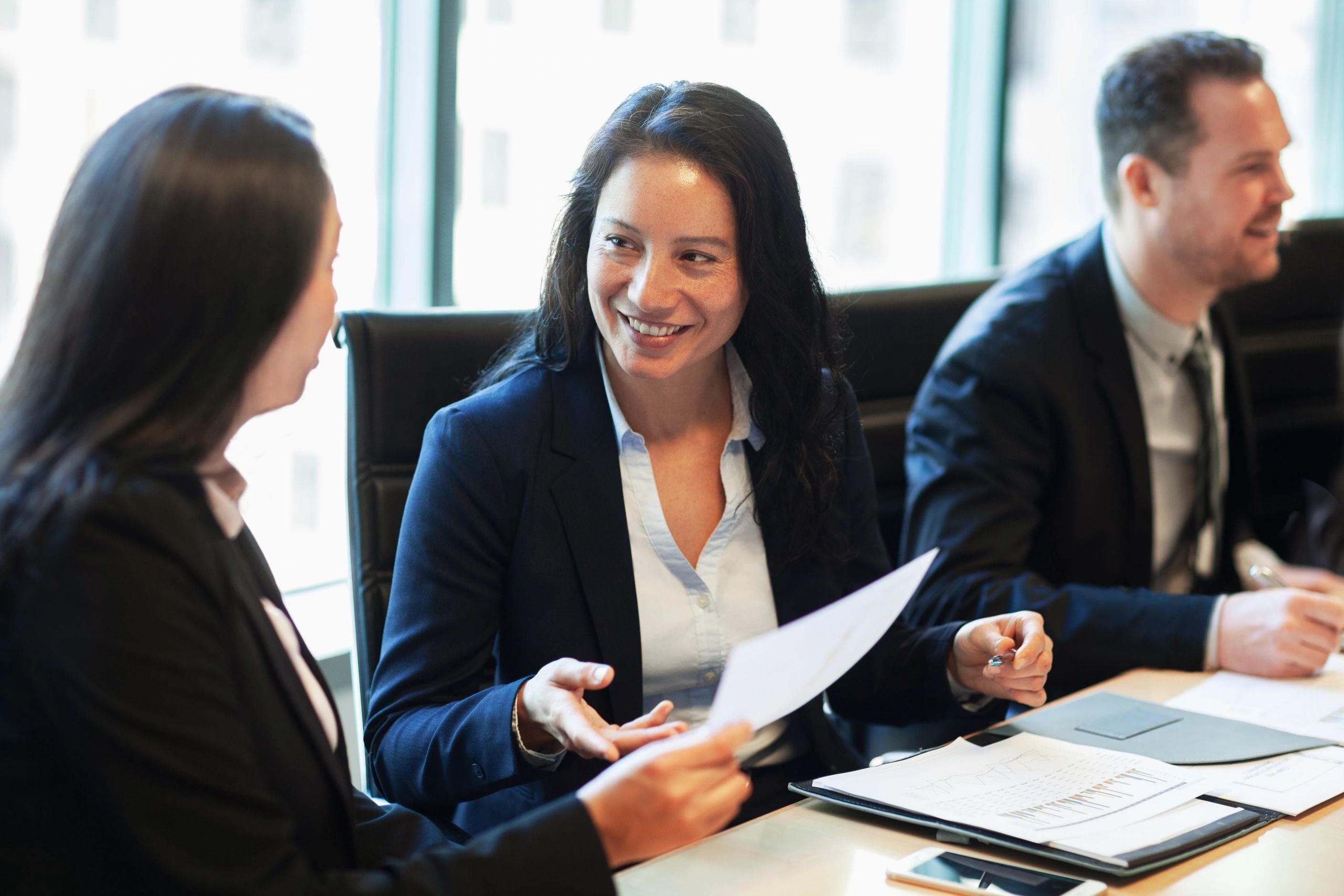 Financial advisor meeting with a client at a conference table