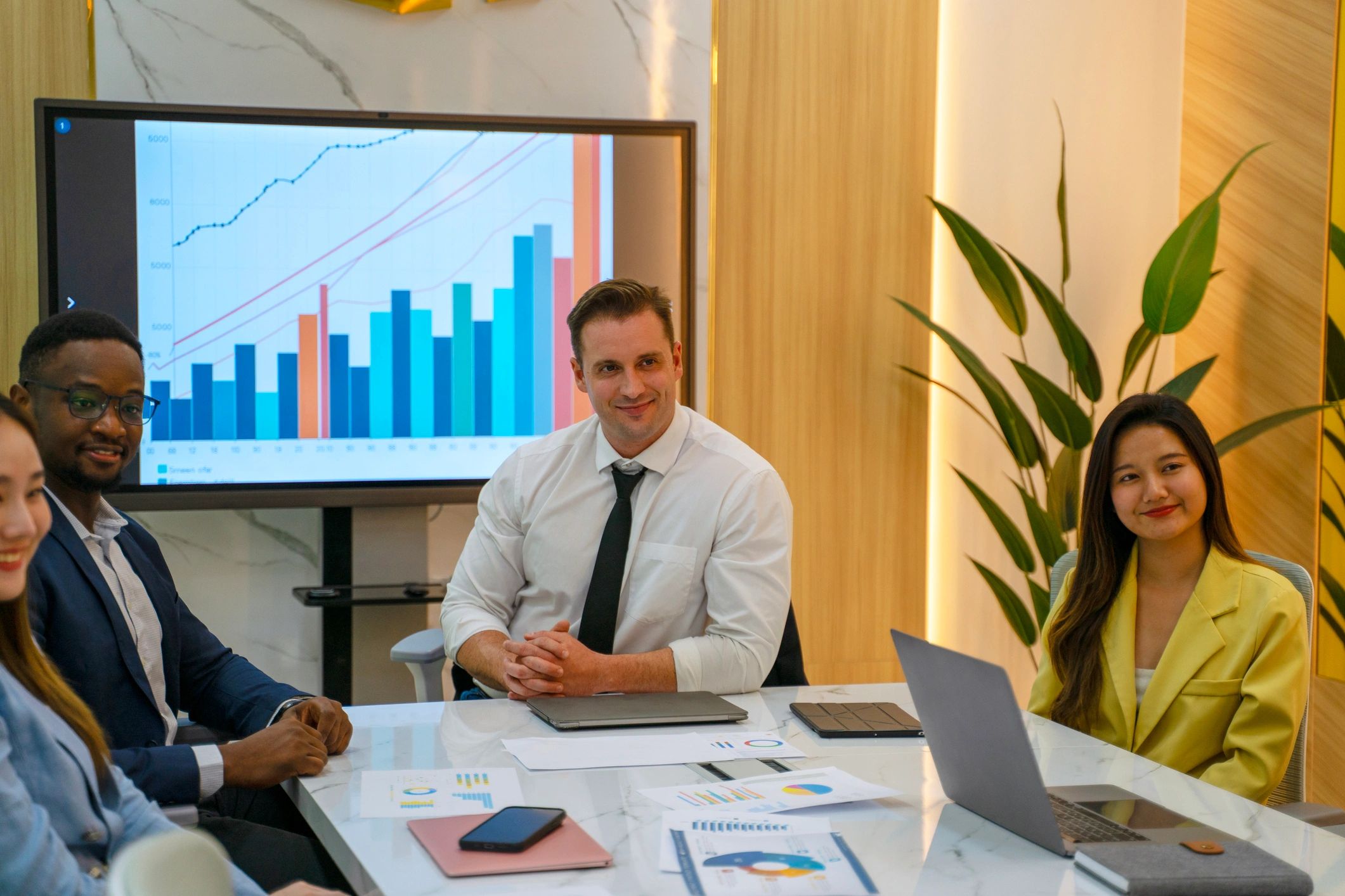 Business professionals meeting in a conference room reviewing audit and compliance matters