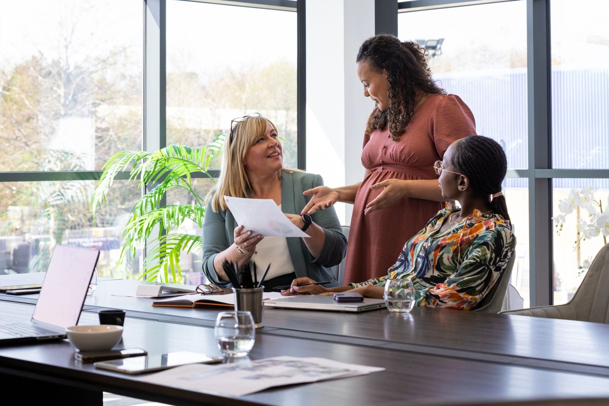 Accounting professionals meeting with clients in a bright office