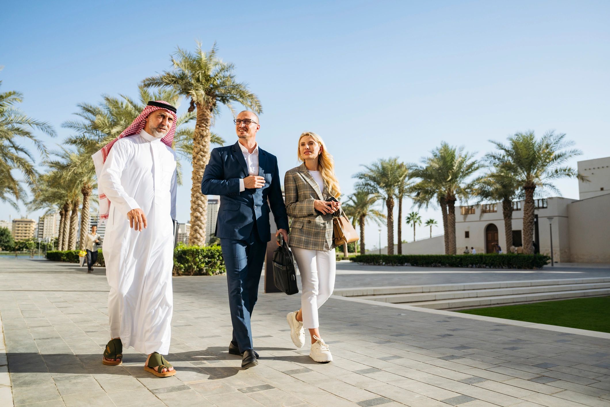 International business professionals discussing strategy during a walking meeting