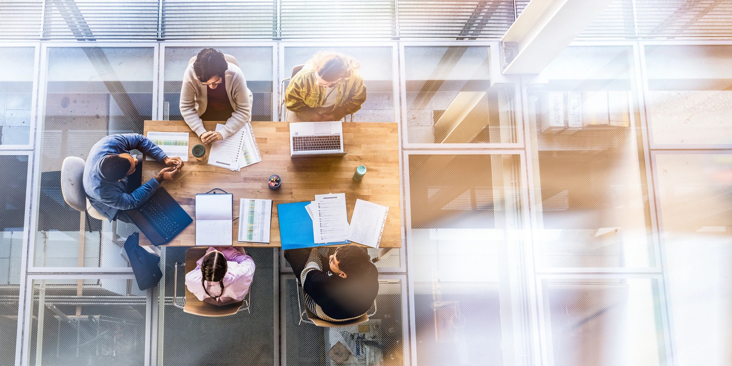 Professionals collaborating in a modern office meeting